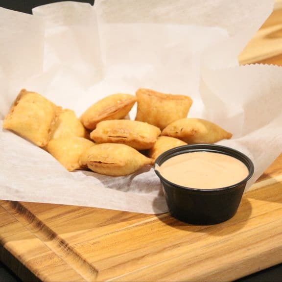 Cheese Pizza Rolls - Ten freshly made pizza rolls filled with melted mozzarella cheese and Italian seasonings, wrapped in a crispy golden crust. Complemented with our house-made marinara sauce.