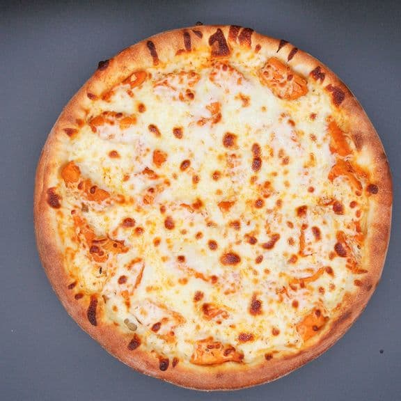 Buffalo Chicken Pizza - Chicken, mozzarella cheese mixed with hot sauce and blue cheese